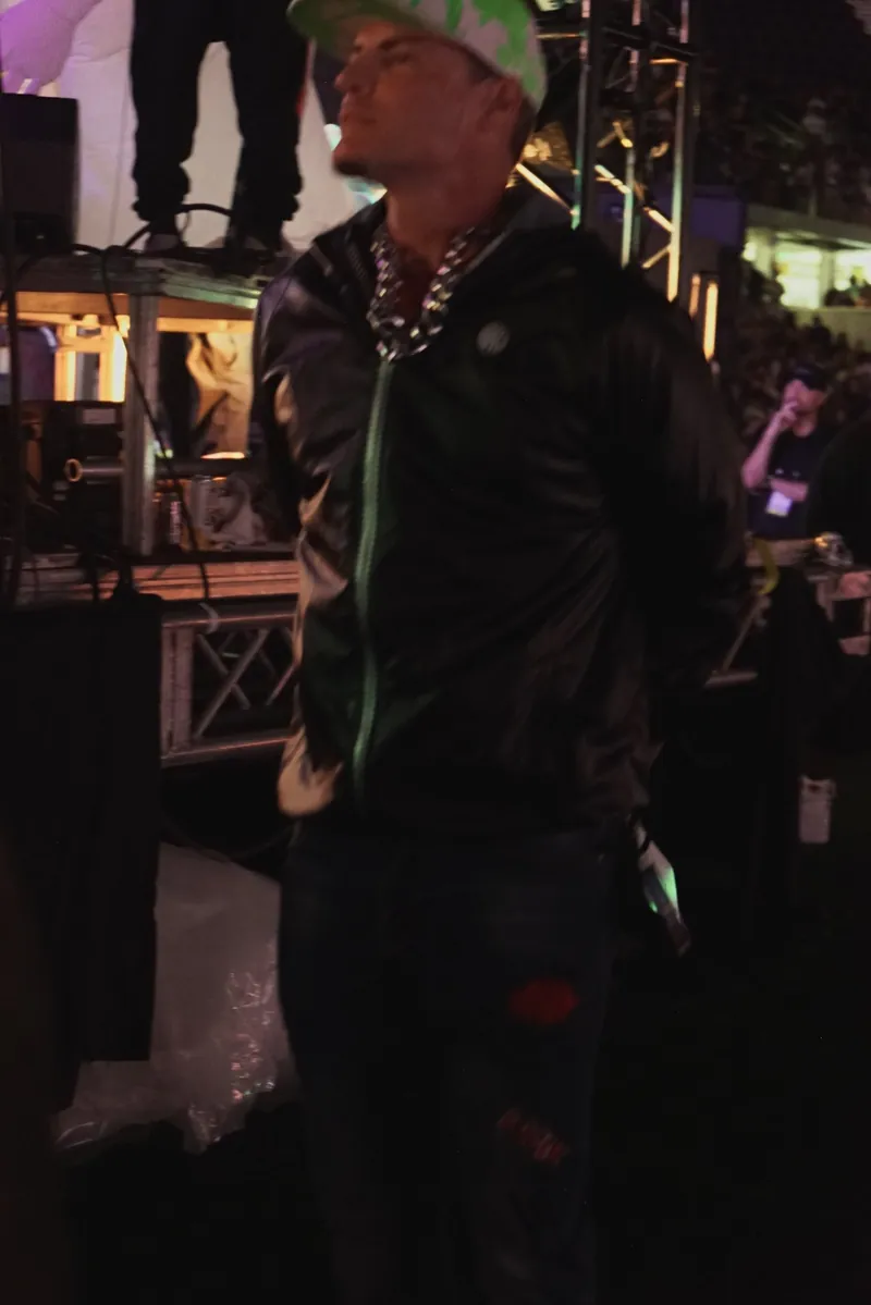 The artist backstage at night under the stage lights